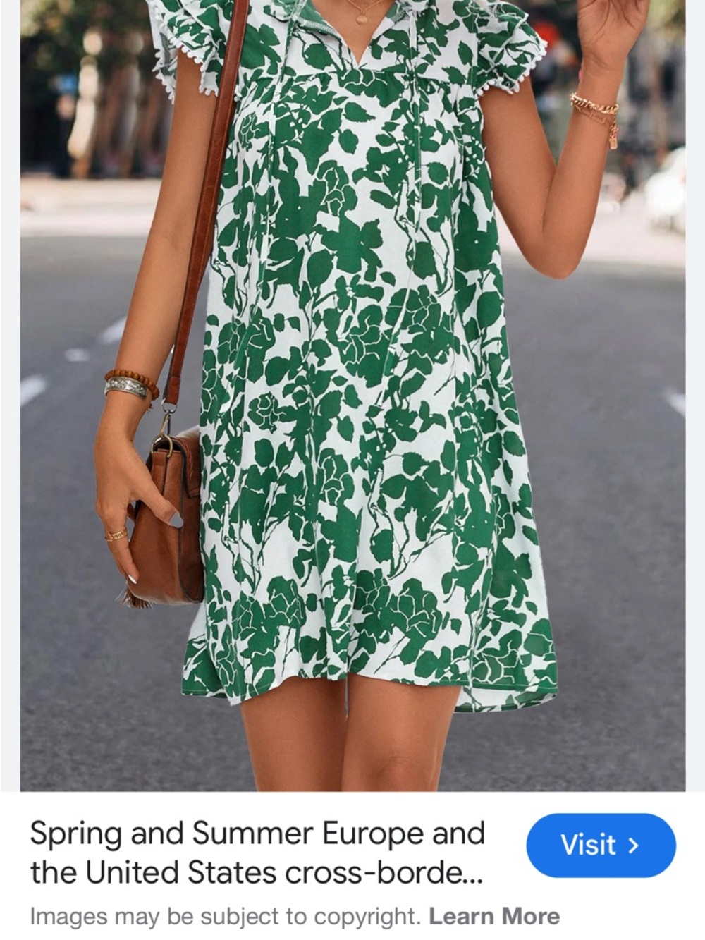 Green and white floral dress with capped ruffle sleeves 
Large